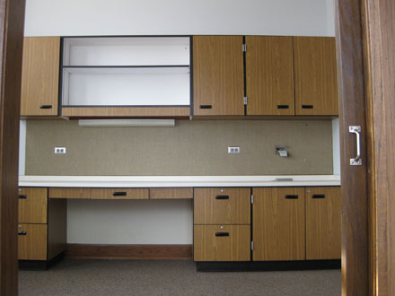 Office 236 has a built in desk and cabinets